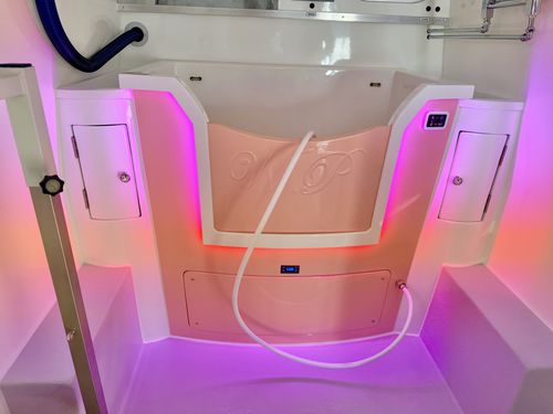 Pink mood lighting setting in a Wet Pets van conversion